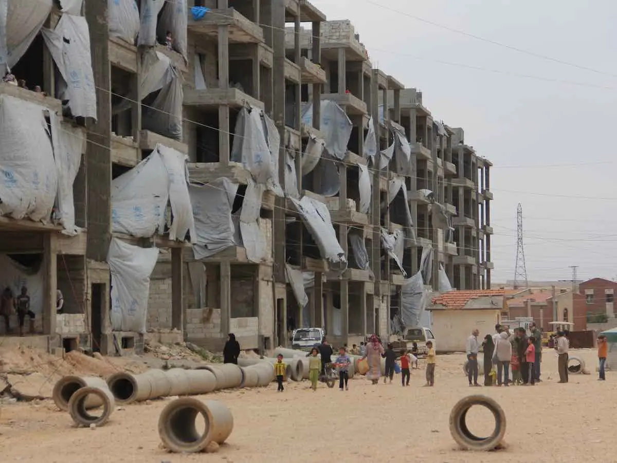In the Syrian Arab Republic, children, women and men go about their daily lives in the Tishreen camp for displaced persons in Aleppo, the capital of Aleppo Governorate.