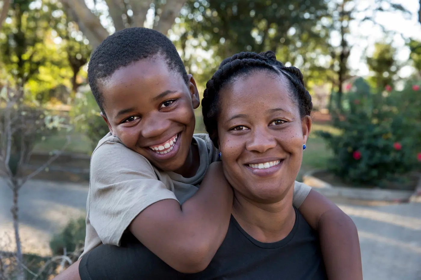 Two People Smiling and Hugging