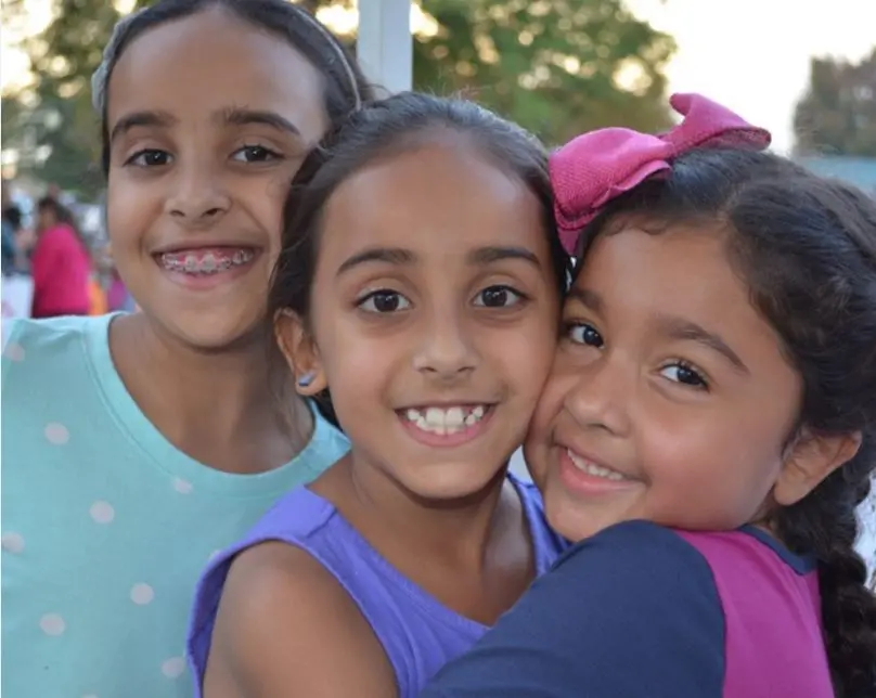Three Children Smiling
