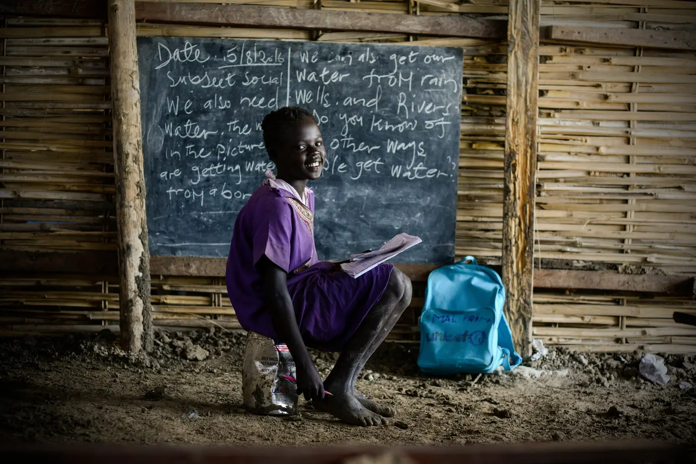 Child In Front of Blackboard