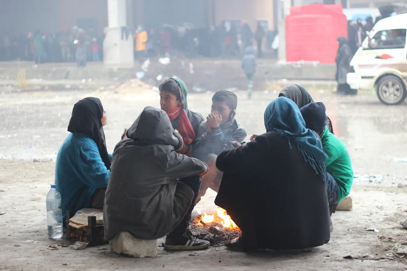 People Huddled Around Fire