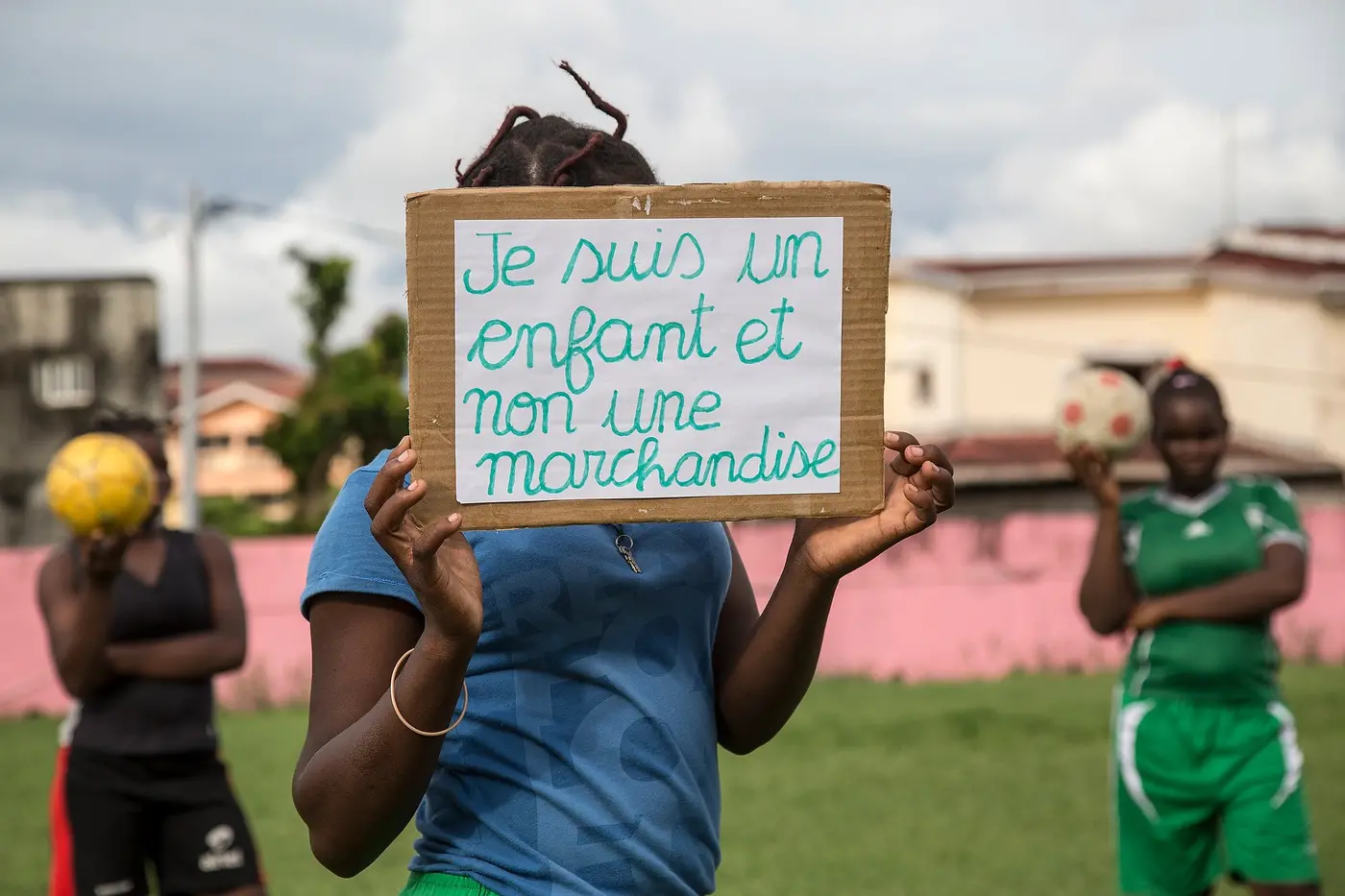 Child Holding Up a Sign