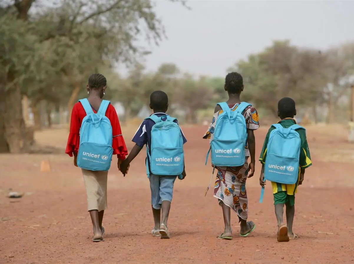 Children on their way home after a day in a child-friendly school in Mougna, Dienne District, central Mali. UNICEF provides each student with a blue backpack filled with school supplies like pens, pencils and rulers. Children on their way home after a day in a child-friendly school in Mougna, Dienne District, central Mali. UNICEF provides each student with a blue backpack filled with school supplies like pens, pencils and rulers.
