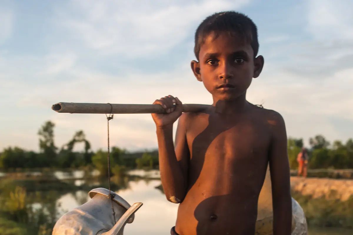 Child Carrying Water