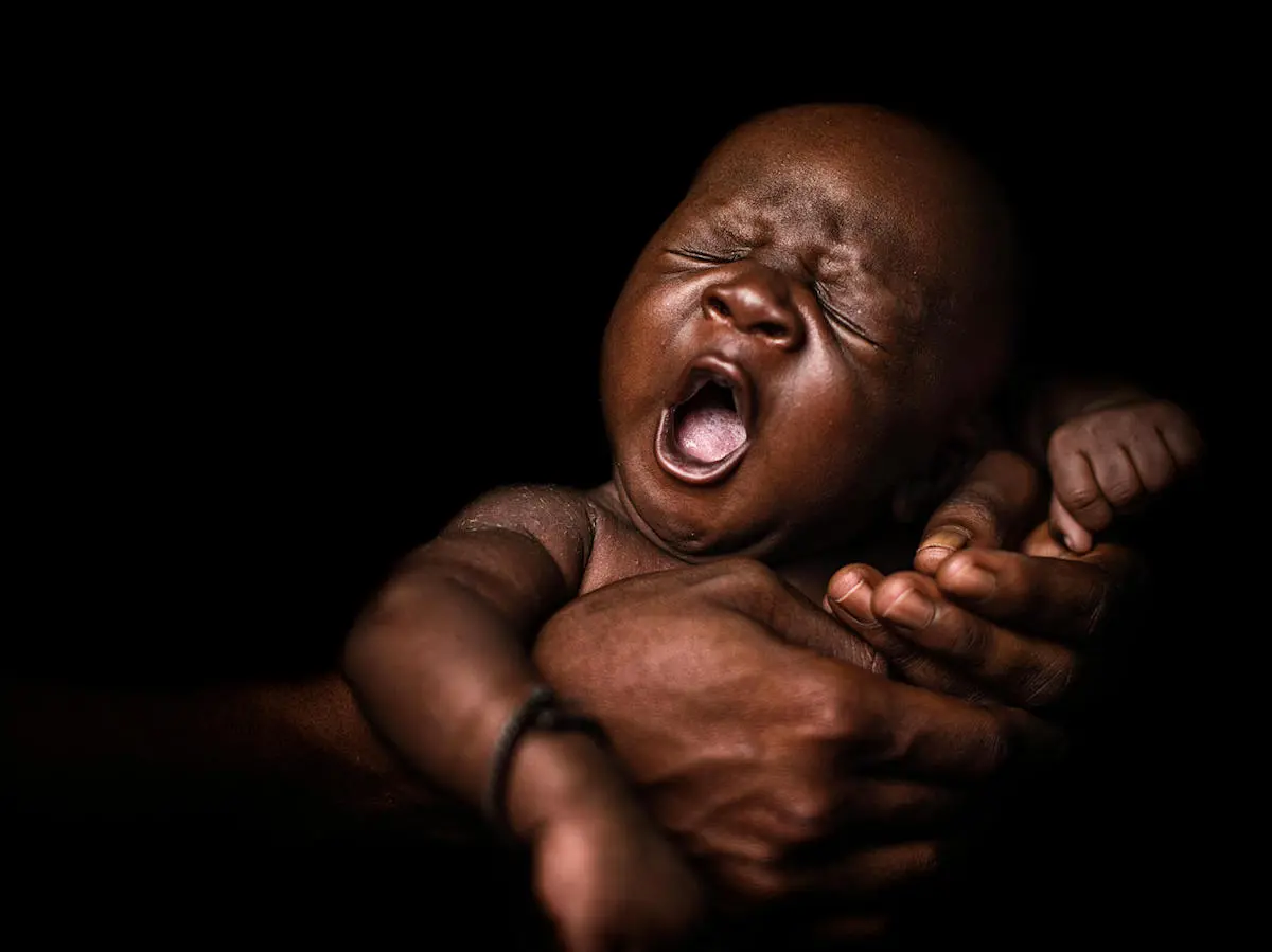 On March 18, 2018, 24-day-old Youssouf is cradled by his mother, Hawa, at a UNICEF-supported community health center in Koumatou, Mali.