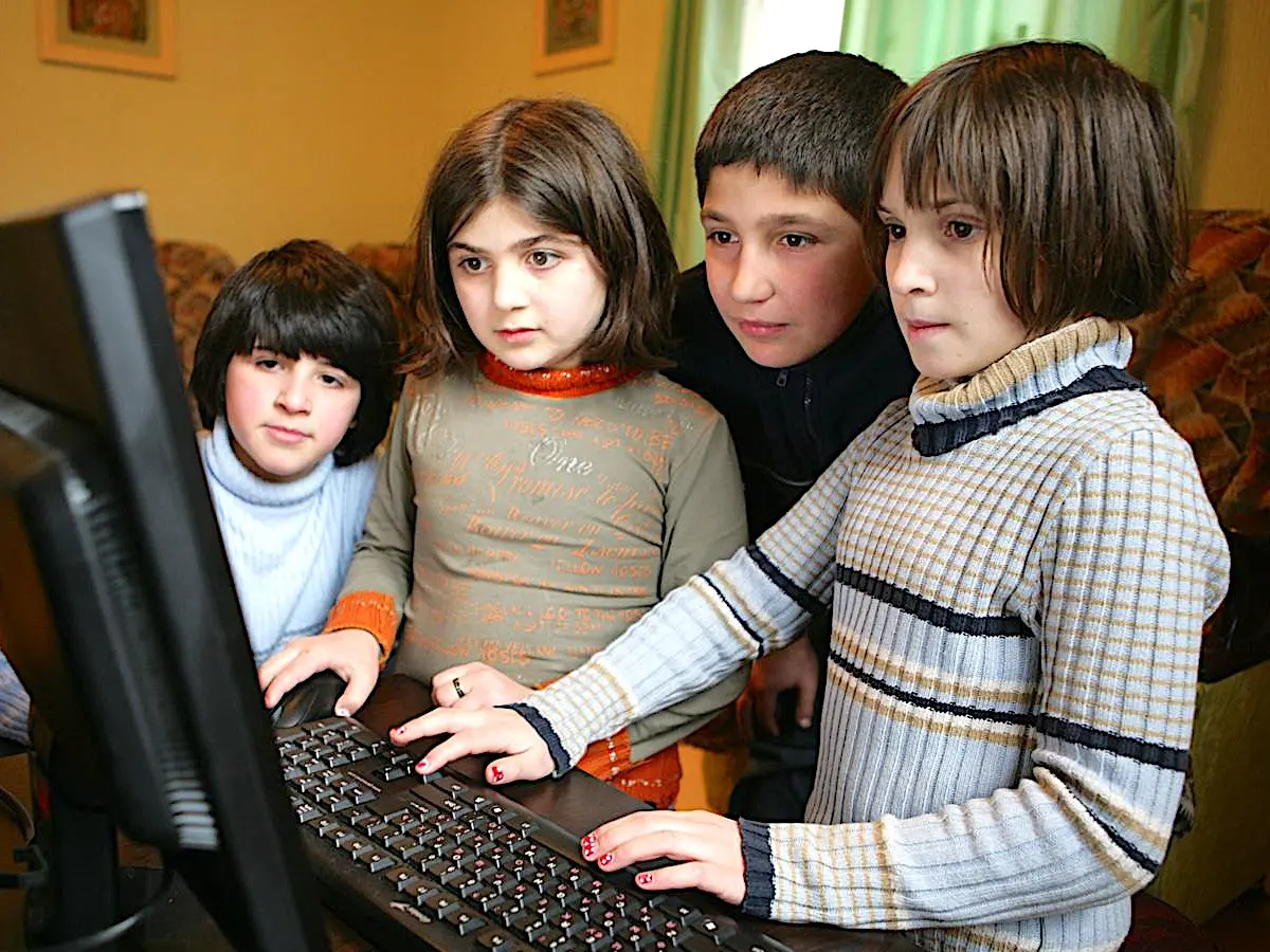 Children use a computer at a UNICEF-supported, small-group home in the southeastern city of Rustavi,