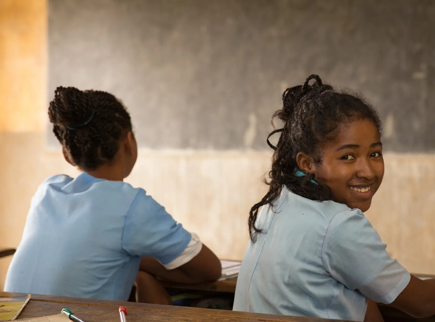 Girl Looking Over Shoulder and Smiling