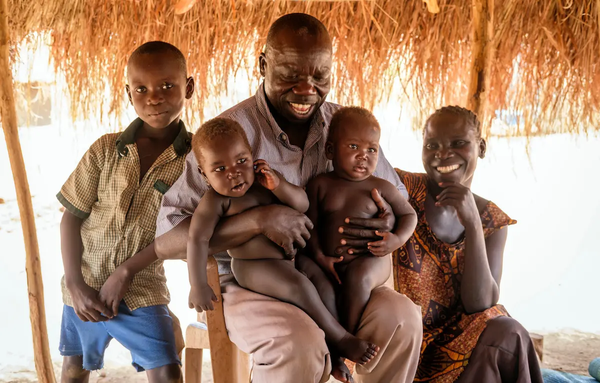 Driven from their home in Morobo, South Sudan by violence, Abura Silvano (center), his wife Ajonye and their children live in Bidi Bidi refugee settlement in northern Uganda. unicef, bidi bidi, father's day, world refugee day, south sudan, refugees