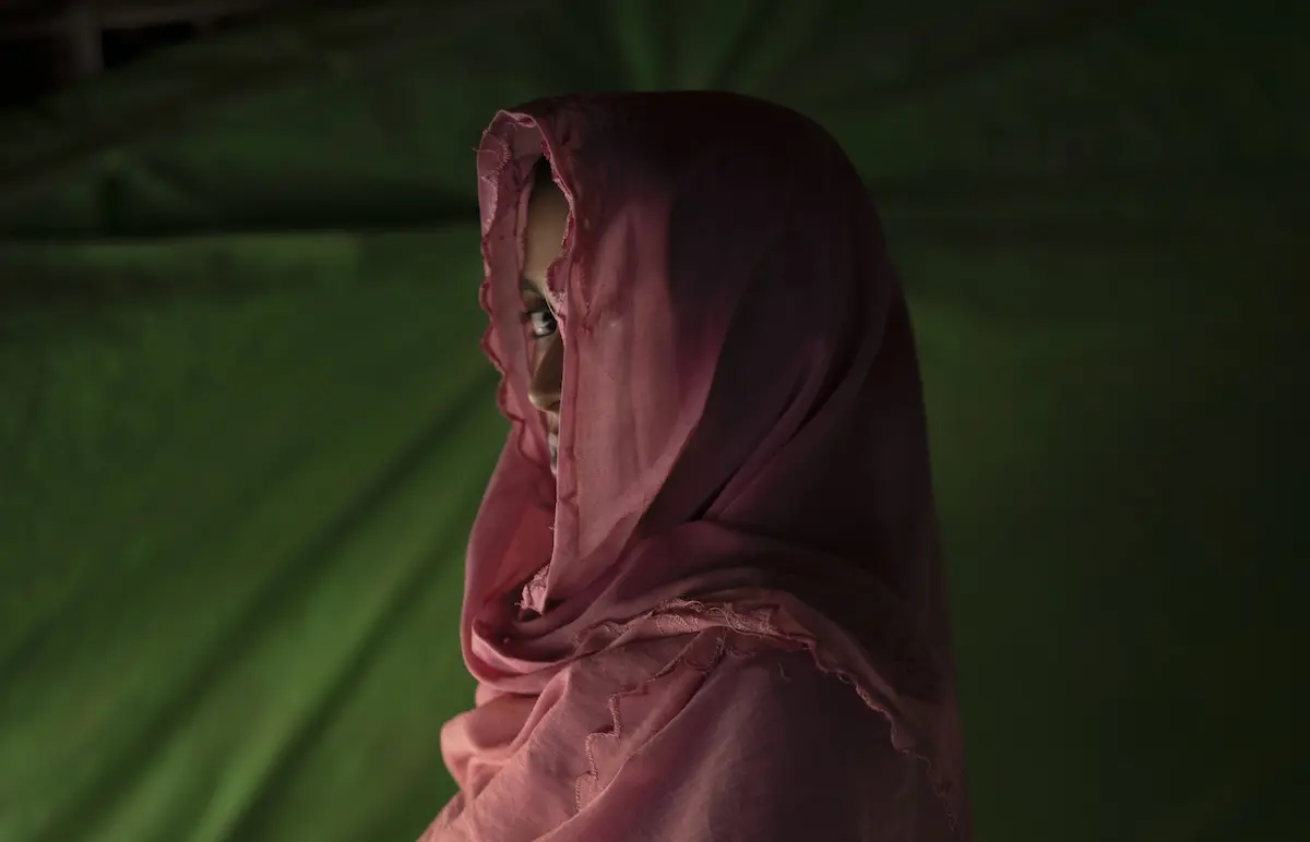 Girl Peering Out from Under Head scarf