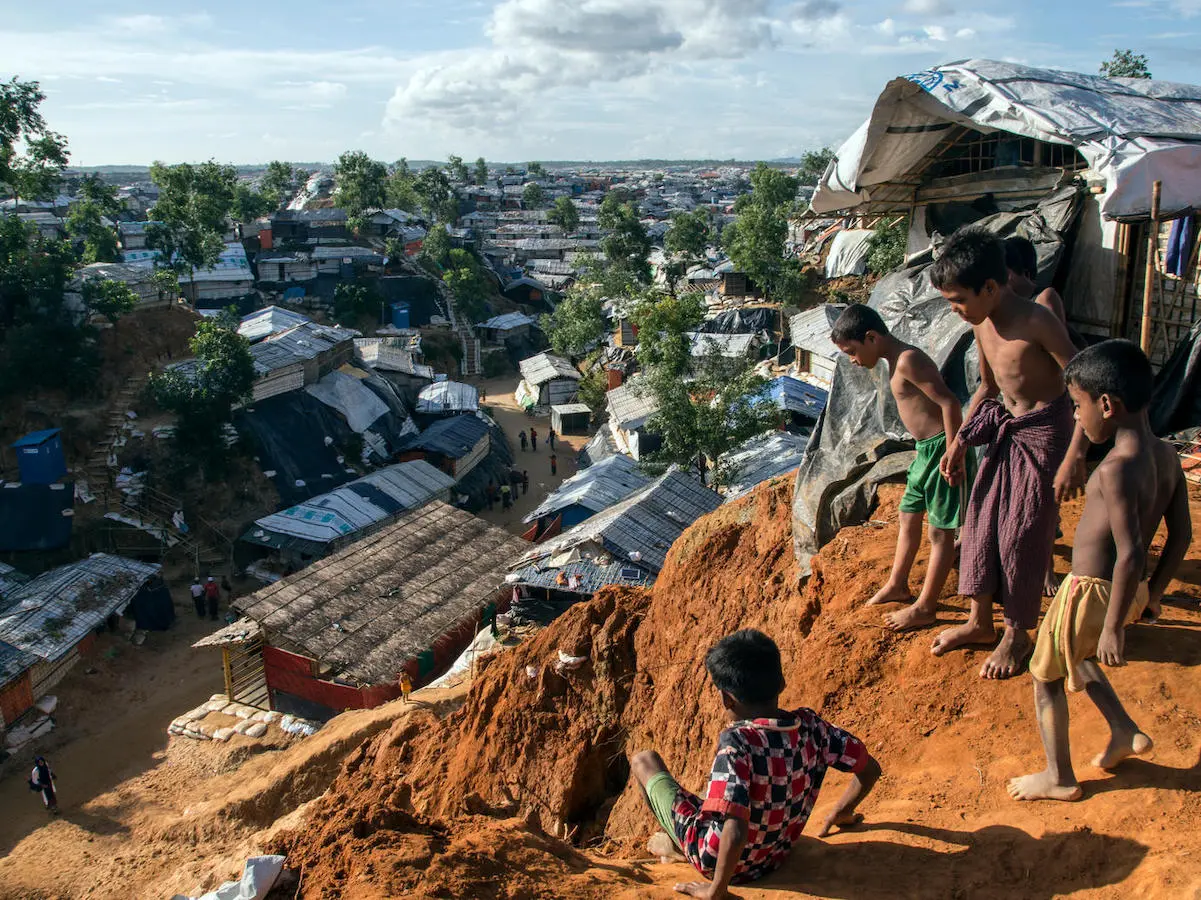 Rohingya refugee boys play on a muddy ridge in BaluKhali refugee camp in Cox's Bazar, Bangladesh in September 2018. Rohingya refugee boys play on a muddy ridge in BaluKhali refugee camp in Cox's Bazar, Bangladesh in September 2018.