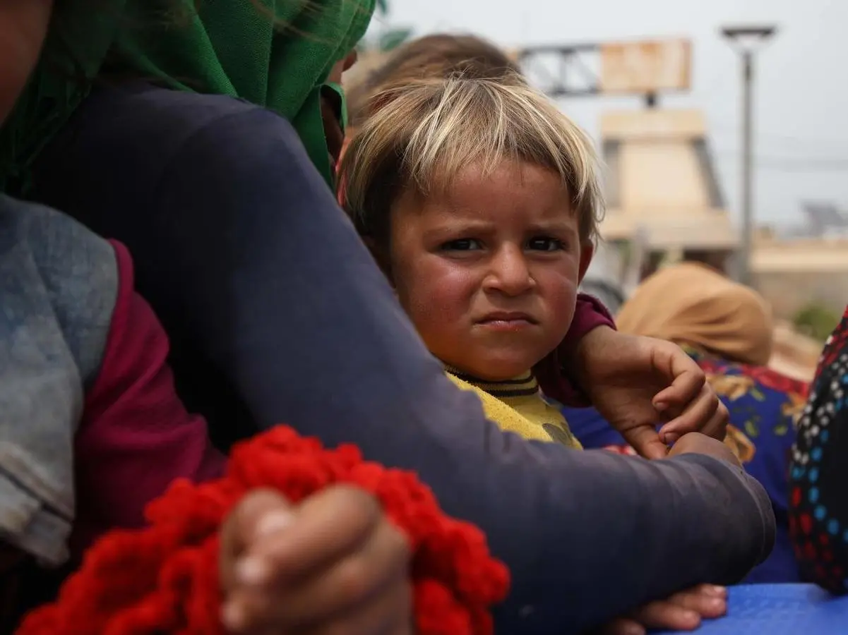 On May 5, 2019 in Atmeh, close to the Turkish border with Syria, trucks carrying families fleeing escalating violence in Idlib. 
