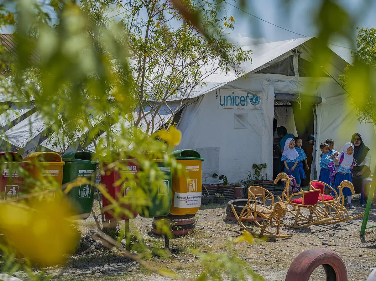 Students leave the UNICEF tent after class finishes in Marawola subdistrict, Central Sulawesi, Indonesia on September 11, 2019.