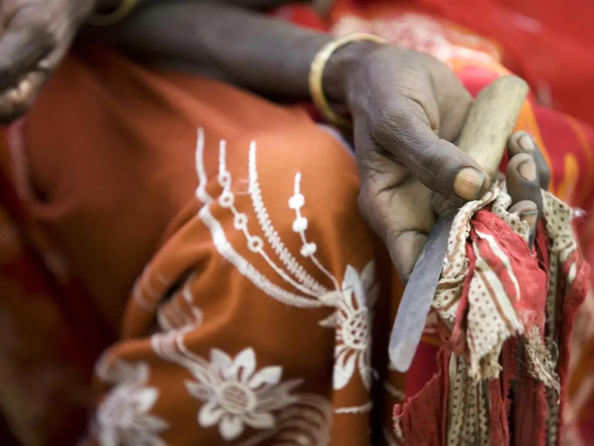 In Ethiopia's Afar Region, a former practitioner of female genital mutilation holds the tool she used to perform the procedure. 