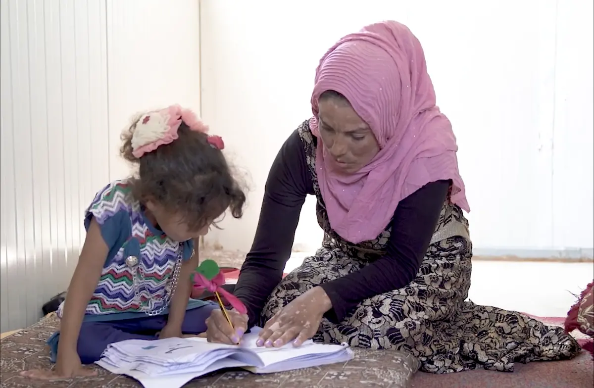 Adult Helping Child Learn