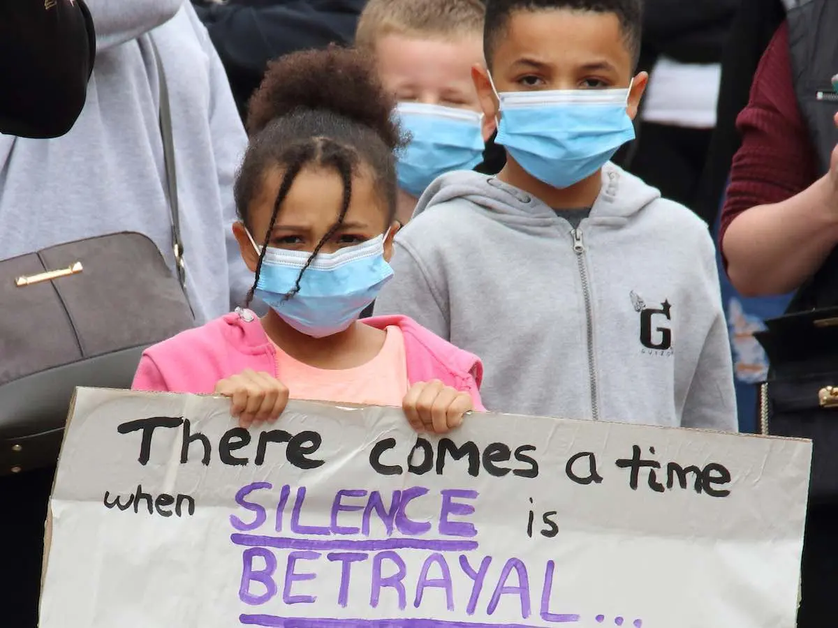 Girl Holding Up Sign