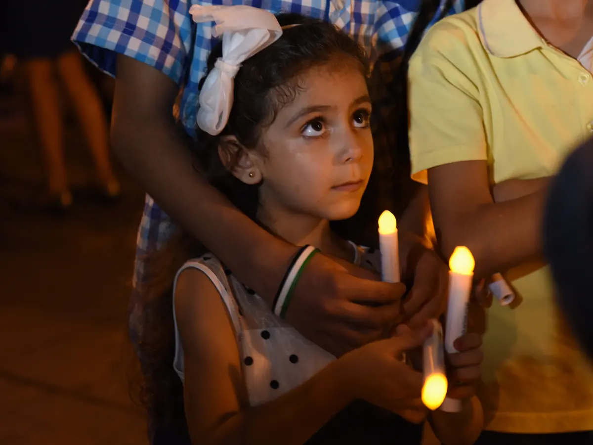 A young girl from Syria attends a candlelight vigil for child refugees at Dag Hammarskjold Plaza in New York City in September 2016.