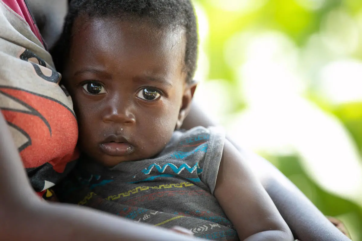 8-month-old Clinton's mother and grandmother of Tusenke, in Zambia's Gwenbe district, receive support through a UNICEF emergency cash transfer program. A prolonged drought in the country has created widespread food insecurity and other hardships.