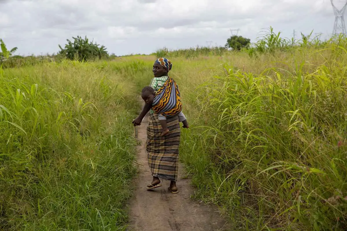 Maria Malo (32) carries her son Antonio Malo (1), after having received treatment at a UNICEF health centre in the Ndjenja Resettlement camp, Mozambique, Wednesday, 04 March 2020. After two major cyclones in one season, extreme drought and renewed floodin