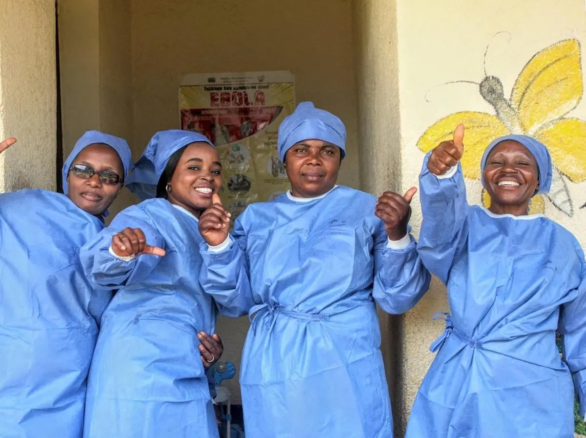 UNICEF-supported health workers celebrate the end of the Ebola outbreak in eastern Democratic Republic of the Congo in June 2020.