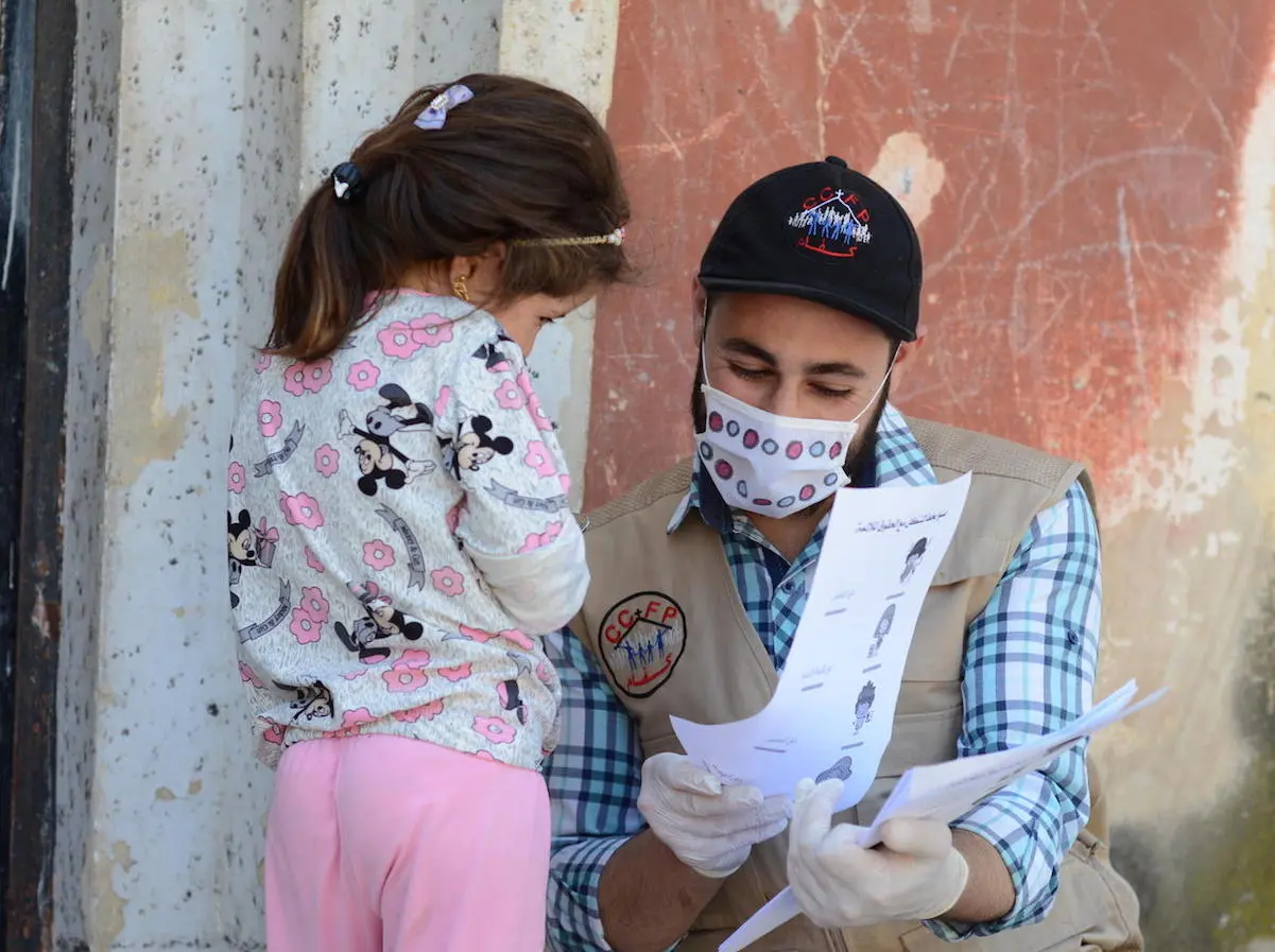 On May 14, 2020, UNICEF-supported volunteer Osama goes door-to-door providing educational activities and COVID-19 prevention information for out-of-school children in northern rural Homs, Syria. On May 14, 2020, UNICEF-supported volunteer Osama goes door-to-door providing educational activities and COVID-19 prevention information for out-of-school children in northern rural Homs, Syria.