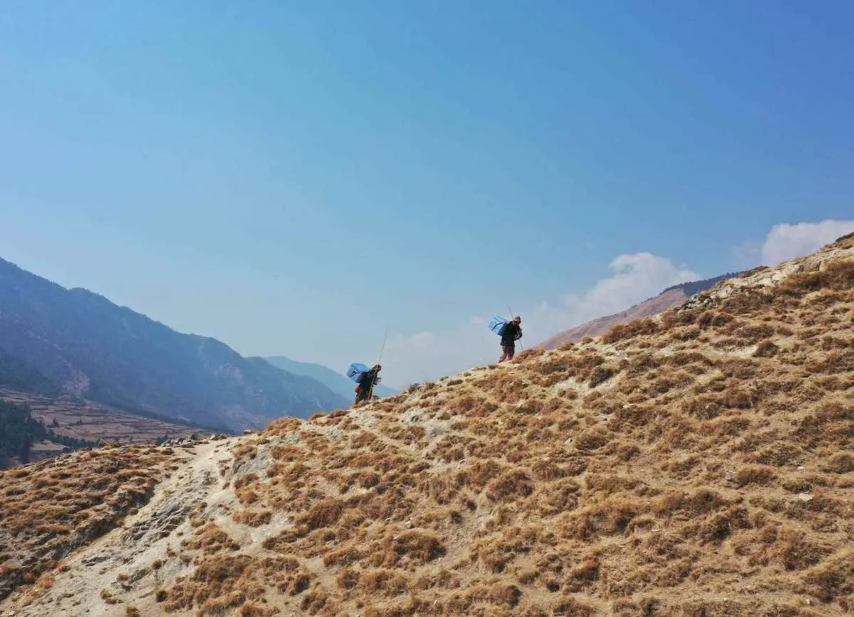 People Hiking Up a Hill