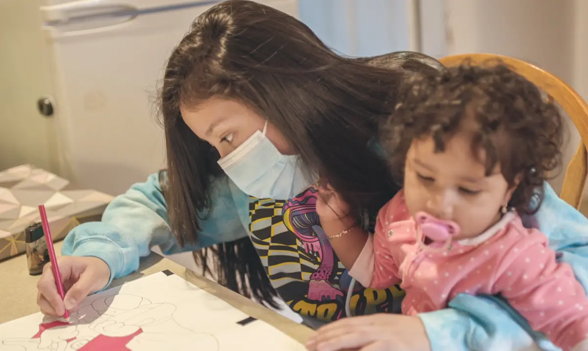 Jennifer, 15, coloring with daughter Scarlett, migrated from Guatemala to the United States when she was 13. She made the trip with her sisters, eventually reunited with their mother in Hempstead, N.Y. Jennifer, 15, coloring with daughter Scarlett, migrated from Guatemala to the United States when she was 13. She made the trip with her sisters, eventually reunited with their mother in Hempstead, N.Y.