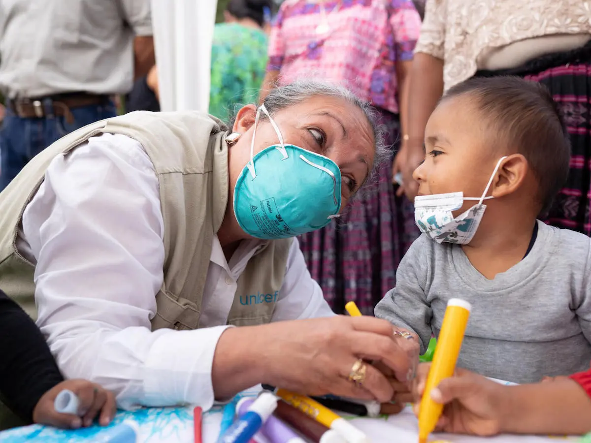 As part of UNICEF's response after back-to-back hurricanes Eta and Iota, UNICEF's Regional Director for Latin America and the Caribbean, Jean Gough, colors with children during an activity at a school in Campur Alta Verapaz, Guatemala. As part of UNICEF's response after back-to-back hurricanes Eta and Iota, UNICEF's Regional Director for Latin America and the Caribbean, Jean Gough, colors with children during an activity at a school in Campur Alta Verapaz, Guatemala.
