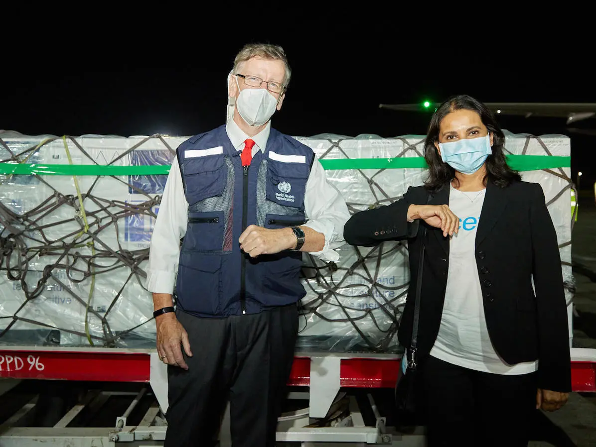 On March 3, 2021, WHO Kenya Representative Rudi Eggers (left) and UNICEF Kenya Representative Maniza Zaman receive the country's first COVID-19 vaccines from the COVAX facility at Jomo Kenyatta International Airport in Nairobi.