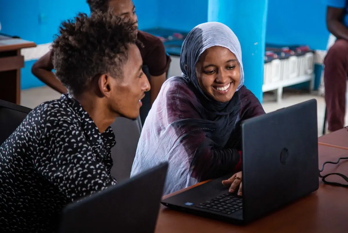 Two People on Laptops