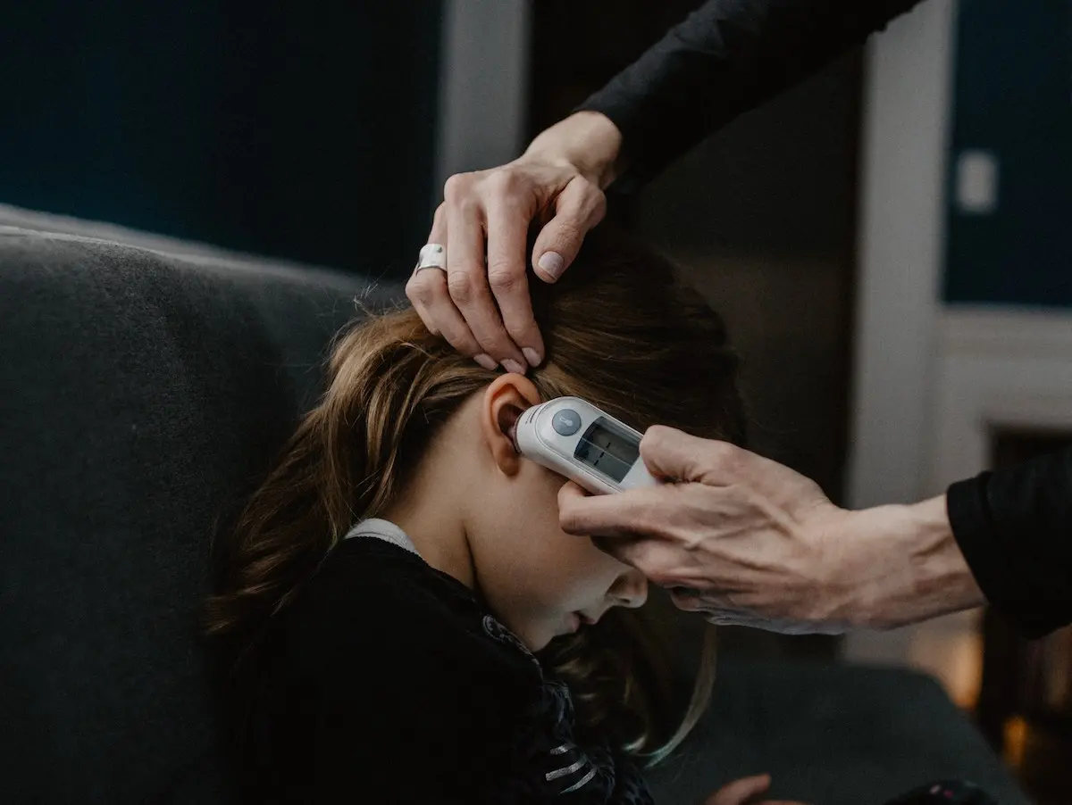 Girl Getting Temperature Taken