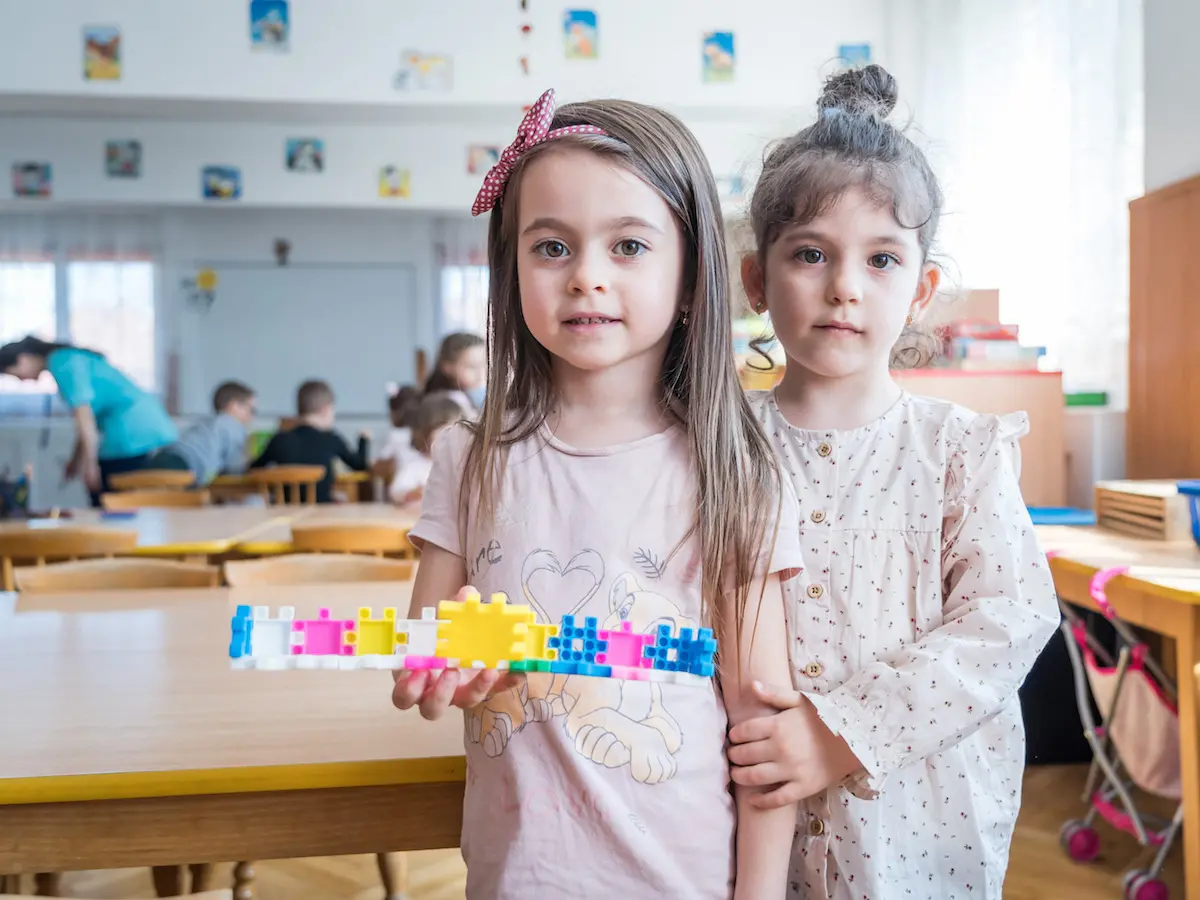 Two kindergarteners worked together to build something beautiful at their school in Brasov, Romania. Two kindergarteners worked together to build something beautiful at their school in Brasov, Romania.