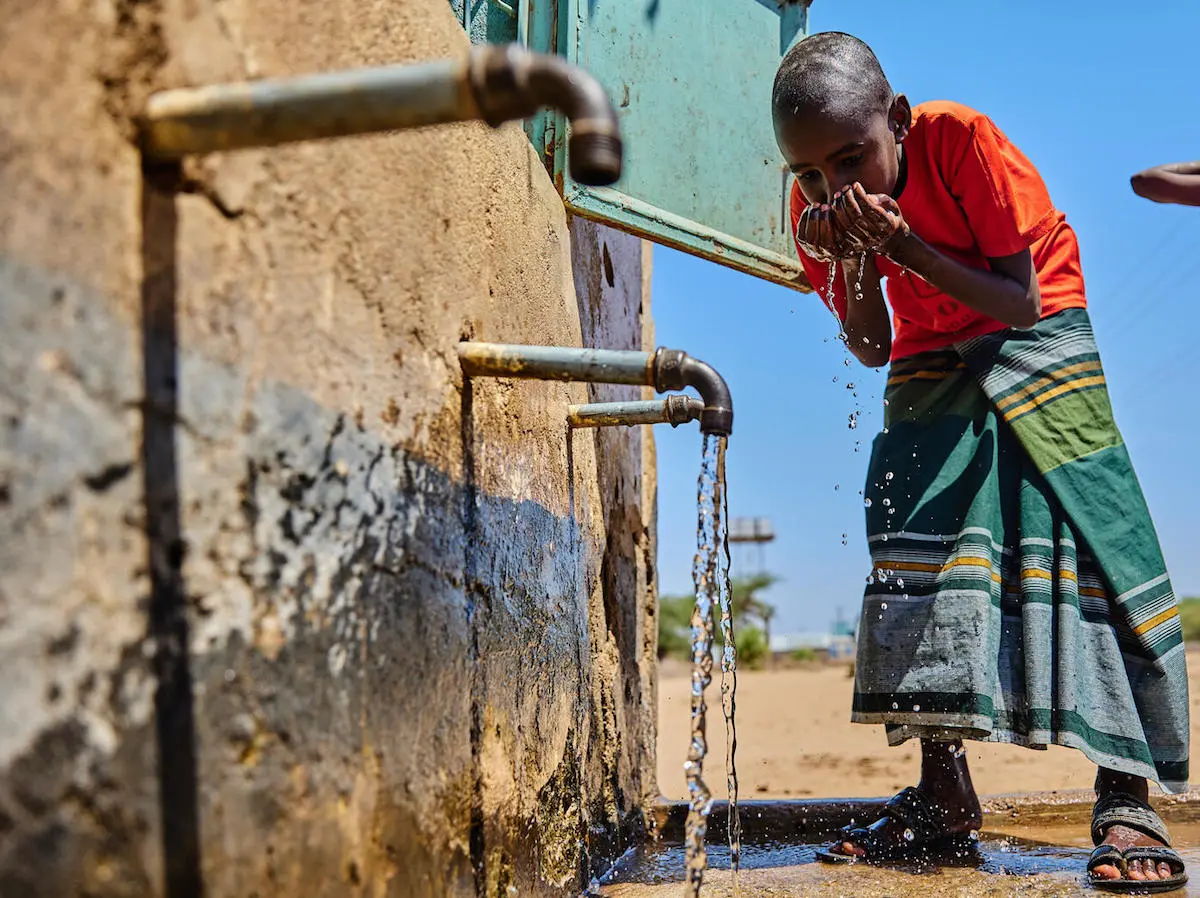 A child drinks water piped from a borehole rehablitated by UNICEF in Garissa County, Kenya. A child drinks water piped from a borehole rehablitated by UNICEF in Garissa County, Kenya.