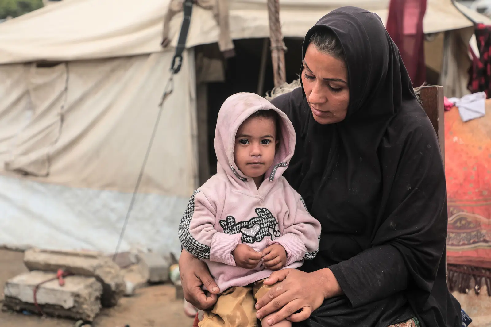 Mother holding a child in her lap