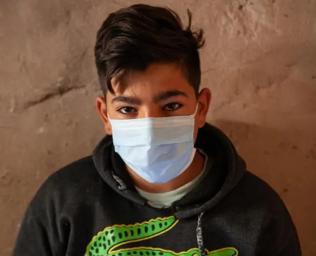 Hadi, 15, picks fruit for five hours a day to help support his family.