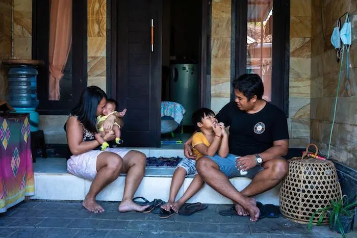 Parents Holding Children