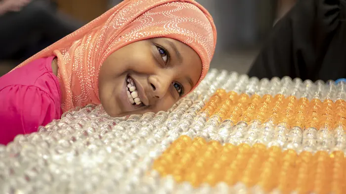 Girl Smiling and Resting Head