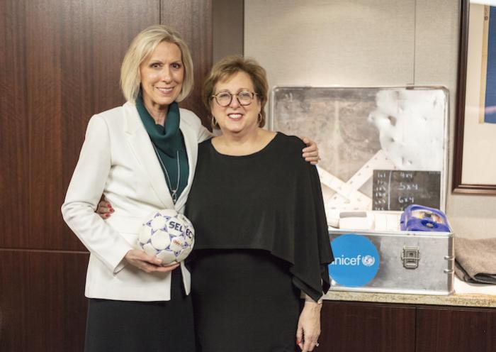 Sister Joy D. Jones, primary general president of The Church of Jesus Christ of Latter-day Saints and Caryl Stern, former president and CEO of UNICEF USA, stand together with a few UNICEF Inspired Gifts displayed in the 2018 Giving Machines.
