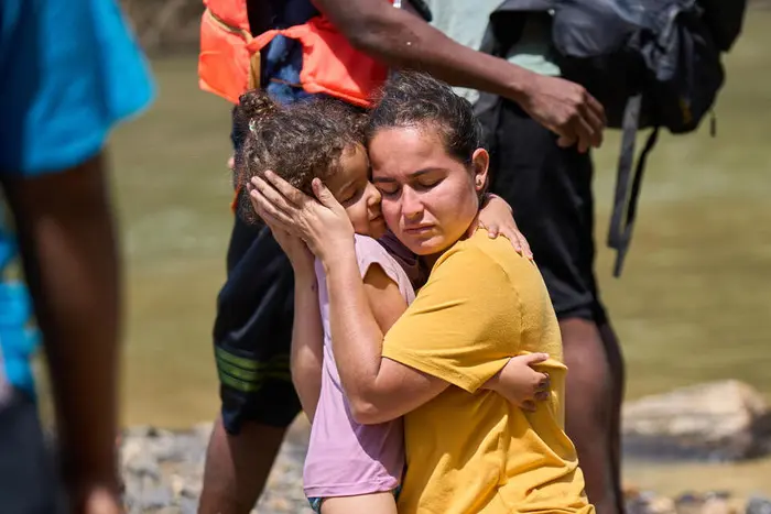 In Lajas Blancas, Dari&eacute;n, Panama in February 2023, a mother and child are reunited after becoming separated in the Dari&eacute;n jungle, one of the world's most dangerous migrant routes.