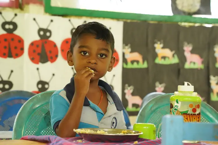 Four-year-old Sageeth eats rice and fruit during mealtime at Little Star Preschool in Deraniyagala, in rural Sri Lanka, one of 725 schools supported by UNICEF. 
