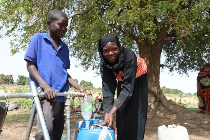 In June 2023, Mariam, a Sudanese refugee from the town of Tendelti, collects water from a borehole installed by UNICEF in the village of Koufroun, eastern Chad. 