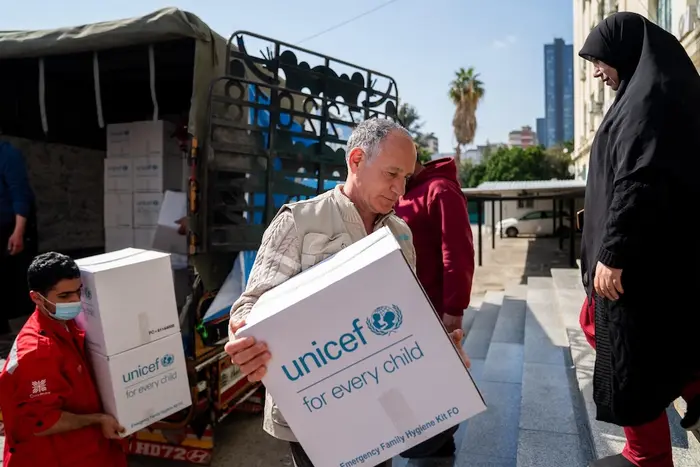 On March 3, 2026, a UNICEF team unloads a truck full of emergency supplies at a shelter in Mount Lebanon for families displaced by escalating conflict.