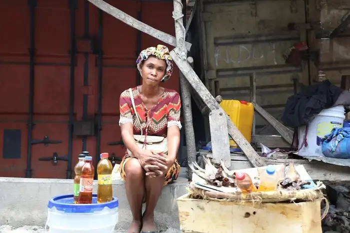 A woman in Haiti who used cash support from UNICEF to start a business.