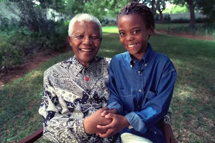 Nelson Mandela and a grandchild.