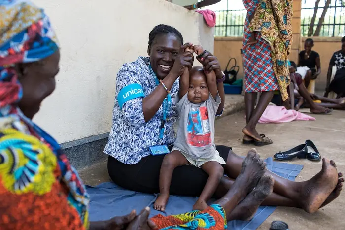 A mother with her child in South Sudan who recovered from severe acute malnutrition with UNICEF support.