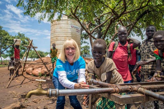 Carol Hamilton, lends a hand at a water point, Kule Camp, Gambella region of Ethiopia. © UNICEF USA