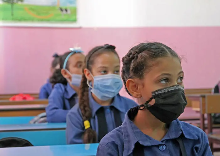 Girls on their first day back to school at Aisha bent Al Mo’meneen school in Amman, Jordan.
