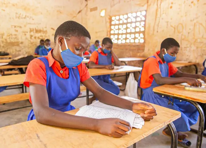 Students at Luwambaza primary school in northern Malawi's Nkhatabay district sit at desks provided by the Kids In Need of Desks Fund. 