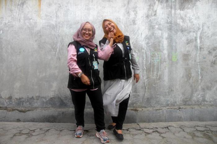 Social workers Kina Sidik (left) and Chi Ramadhani work as part of the UNICEF-supported family tracing and reunification program in Central Sulawesi.