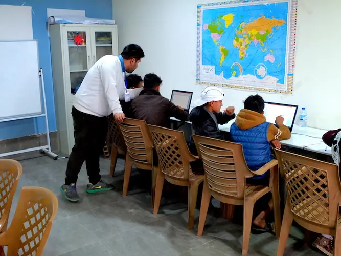 A computer literacy class for young people living in Debaga camp in northern Iraq.