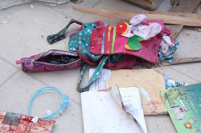 The back pack of 9-year old Zaina, and the textbook of her sister Lamar, 11. Zaina and Lama as well as Ismail, 5, and his sister Hanadi, 9, were killed by a mortar attack on their way to school in Aleppo. 